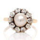 Antique natural pearl and 1.30 ct old mine cut diamond daisy ring