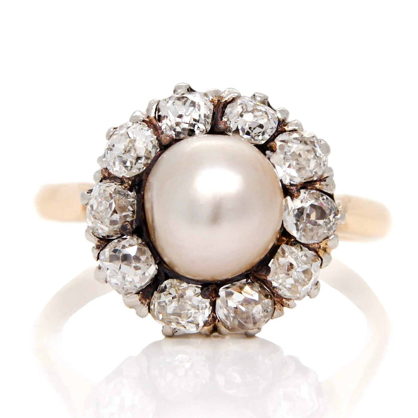 Antique natural pearl and 1.30 ct old mine cut diamond daisy ring