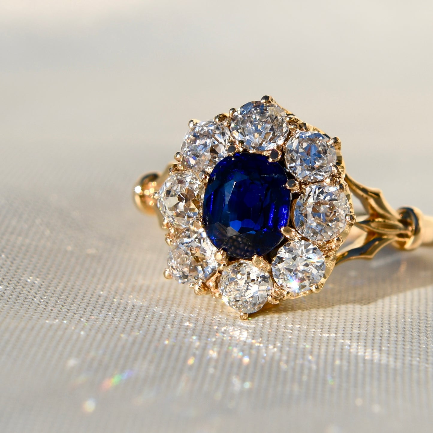 1.15 ct sapphire and old mine cut diamond cluster ring