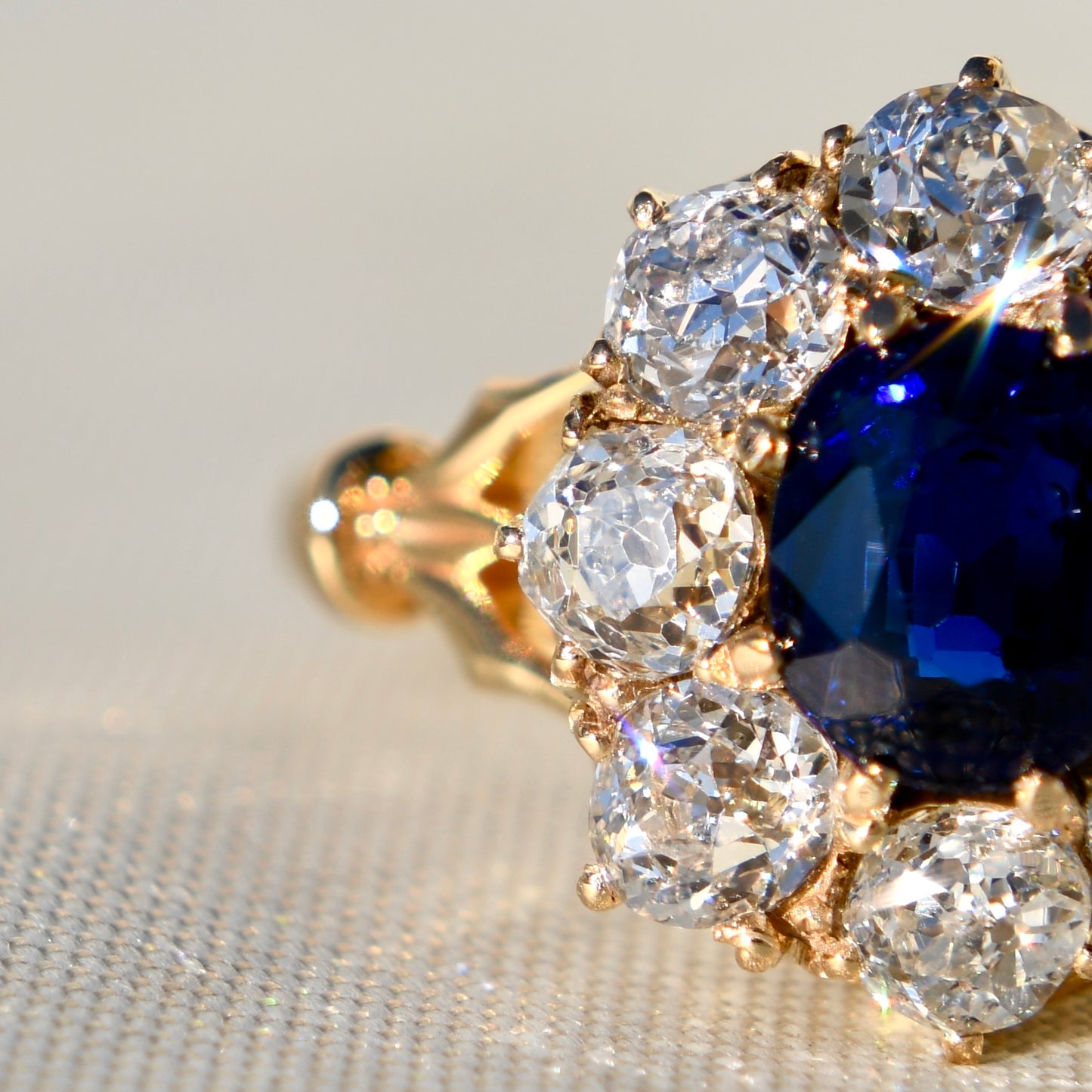 1.15 ct sapphire and old mine cut diamond cluster ring
