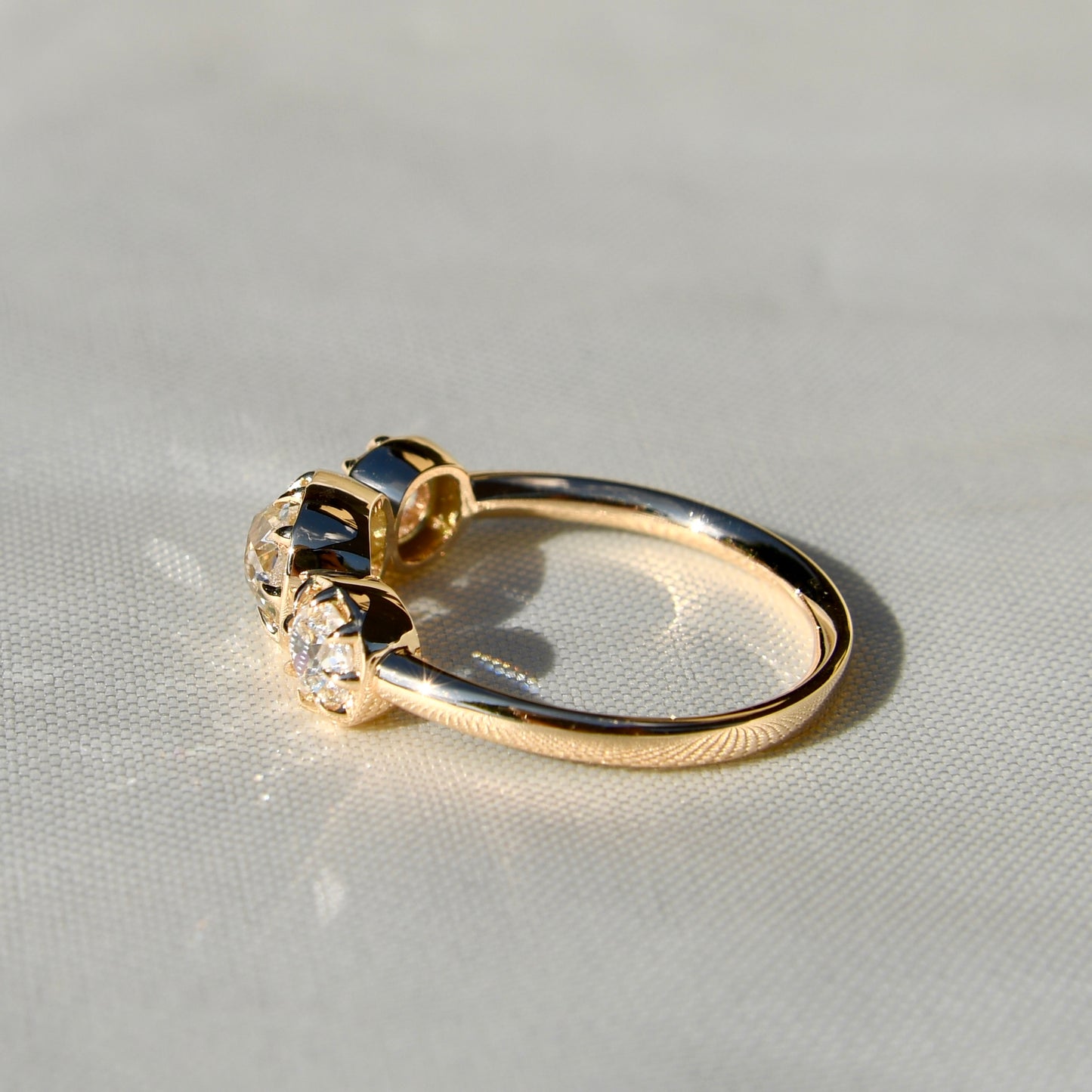 0.86 ct old mine cut diamond three stone ring