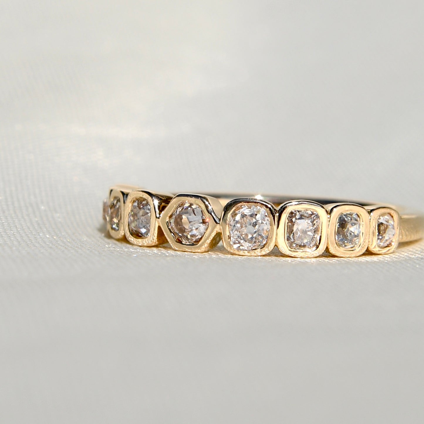 0.57 ct hexagonal, old mine and peruzzi cut diamond nine stone ring