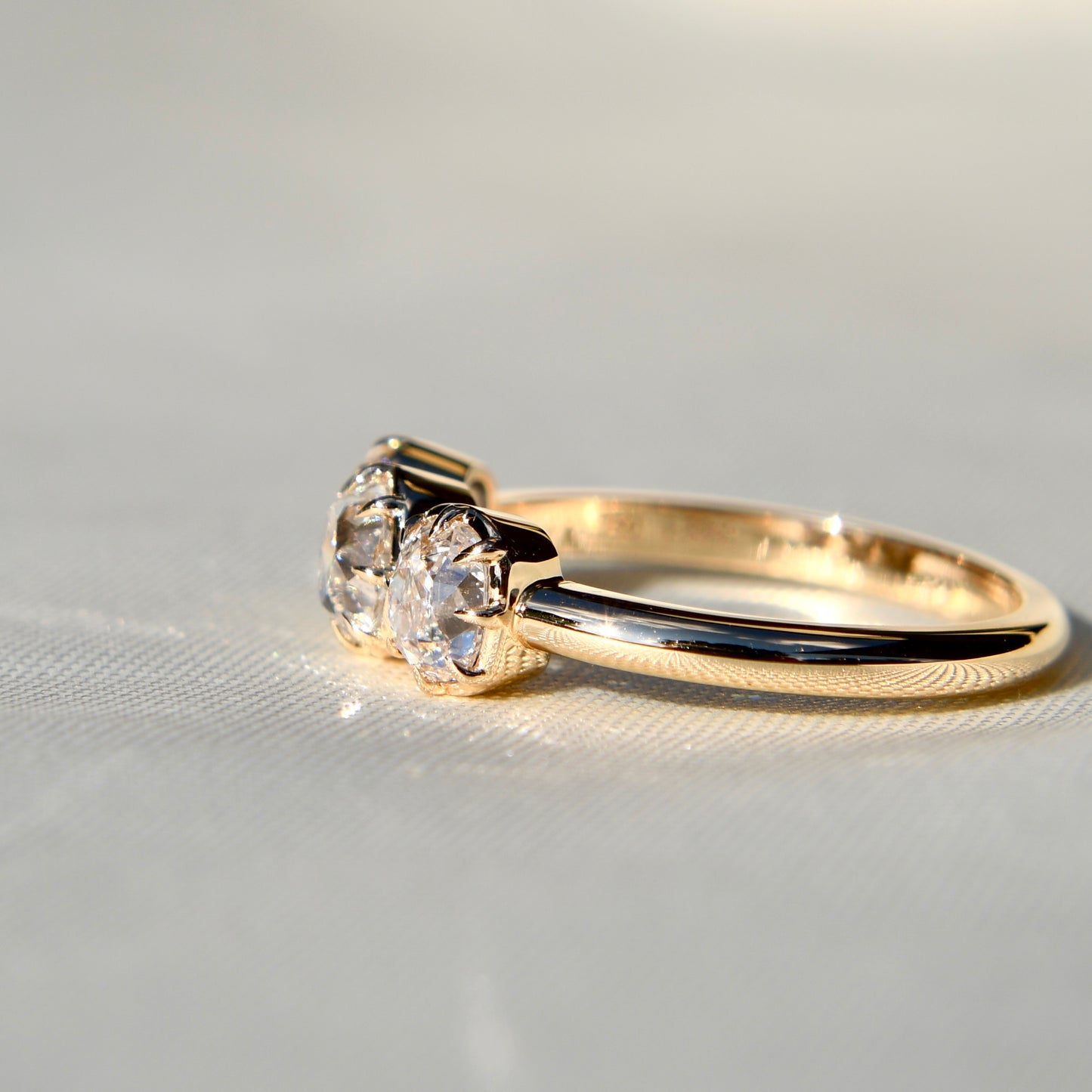 0.53 ct old mine cut diamond three stone ring