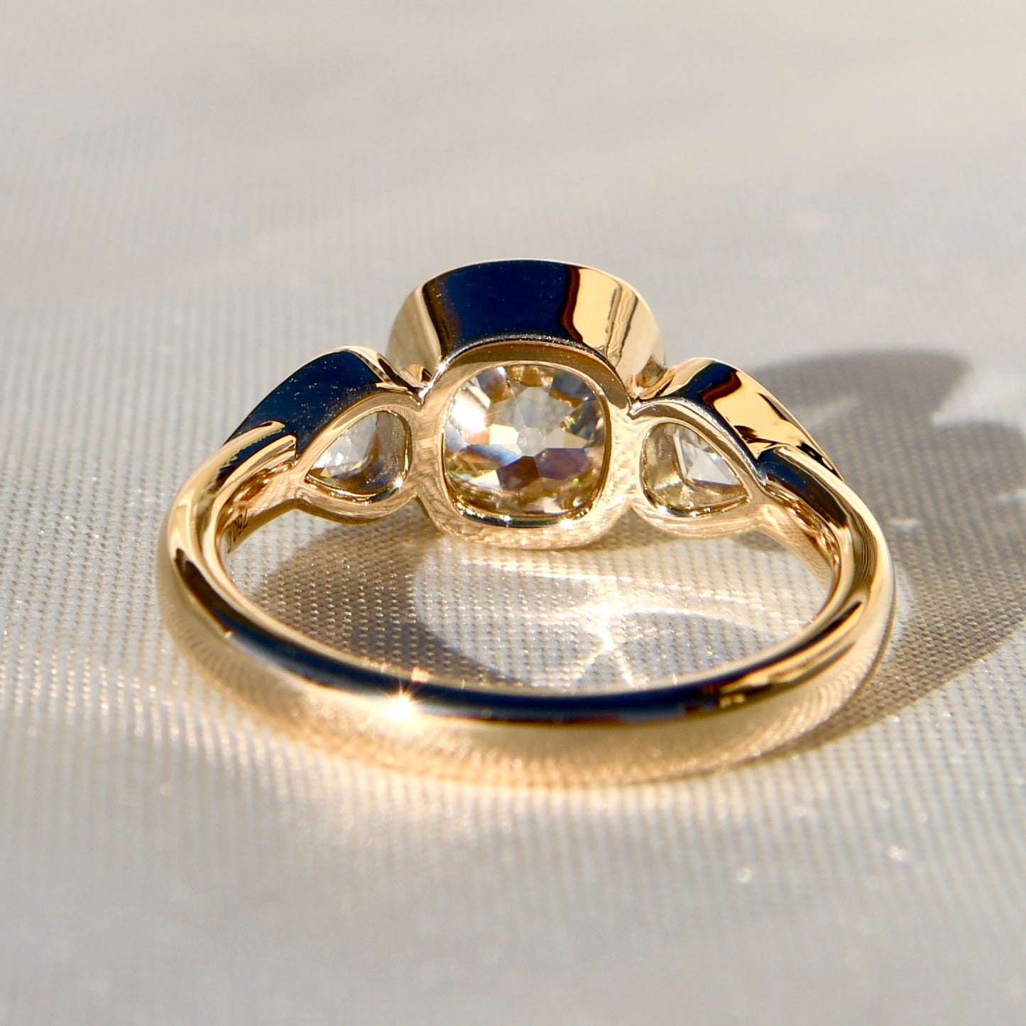 1.78 ct old mine and pear rose cut diamond three stone ring