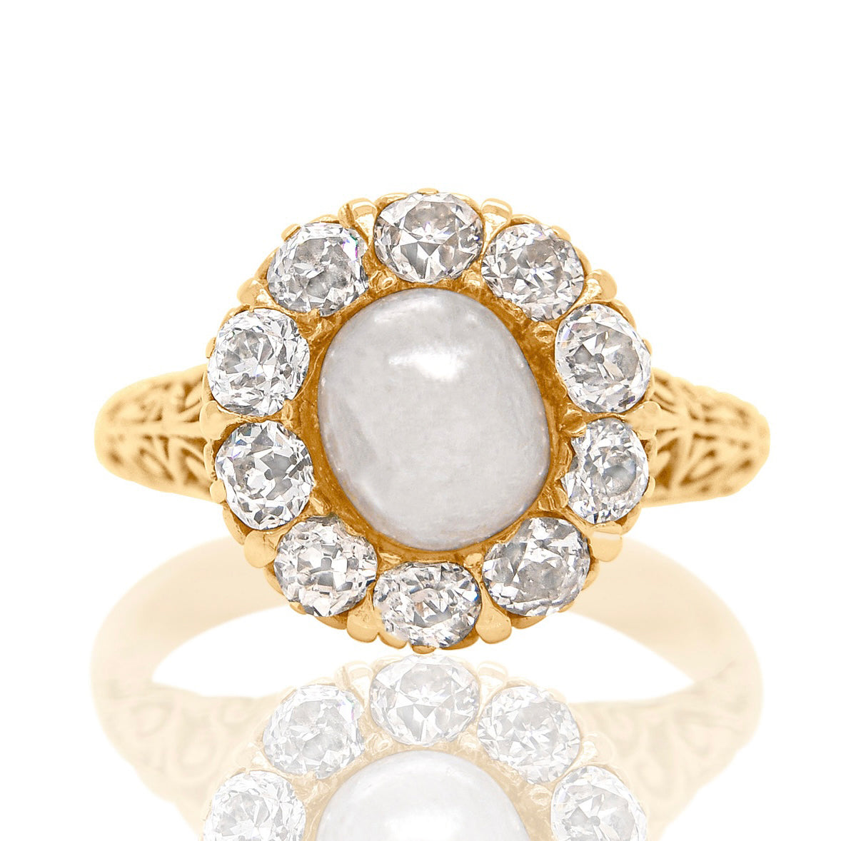 Antique natural pearl and 1.20 ct old mine cut diamond daisy ring