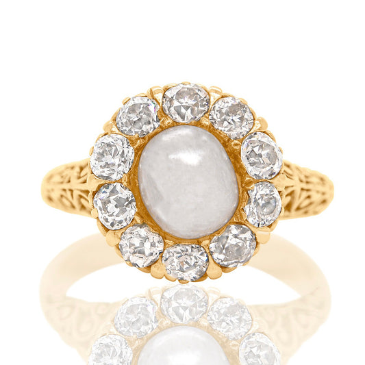 Antique natural pearl and 1.20 ct old mine cut diamond daisy ring