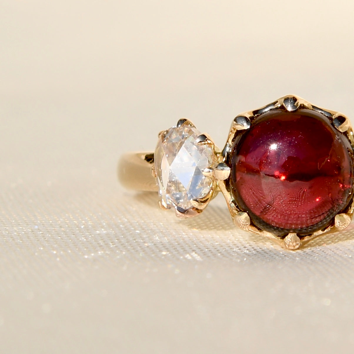 2.15 ct tourmaline cabochon and rose cut diamond three stone ring