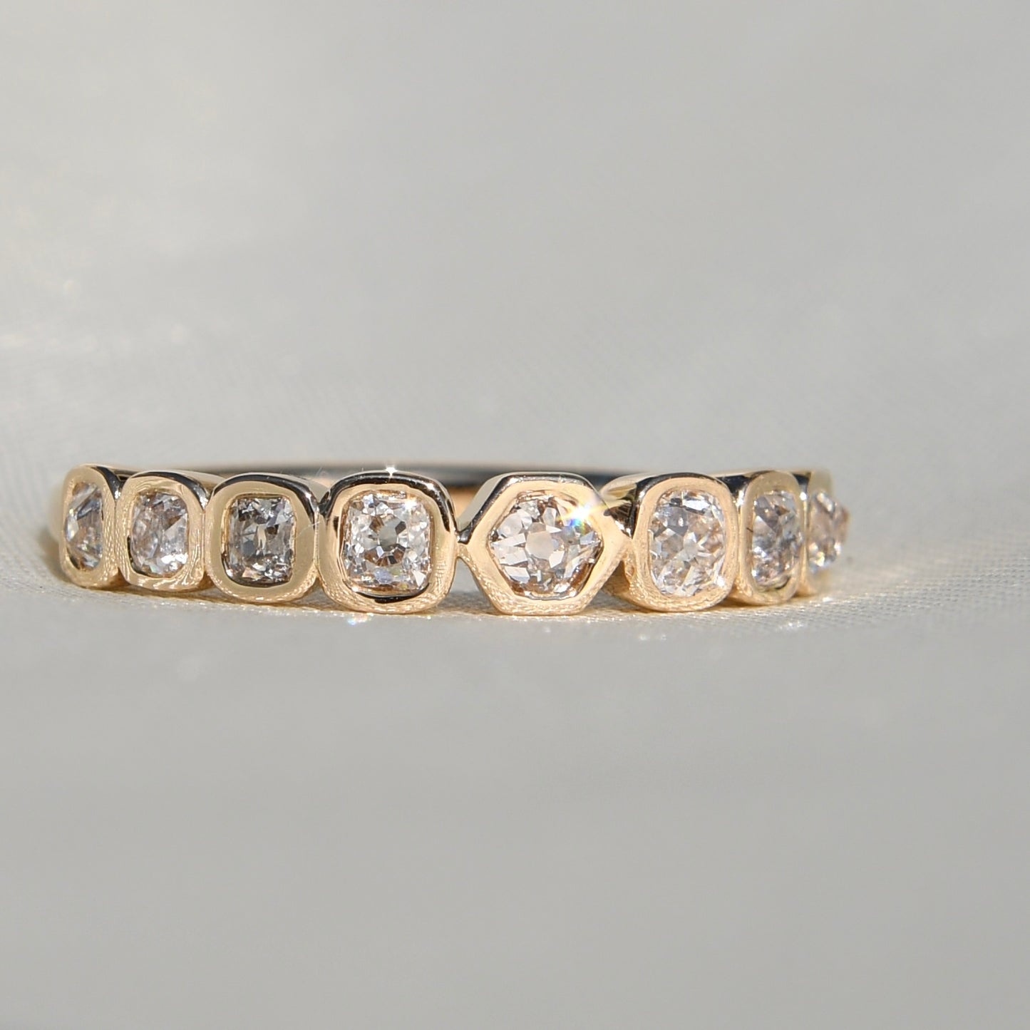 0.57 ct hexagonal, old mine and peruzzi cut diamond nine stone ring