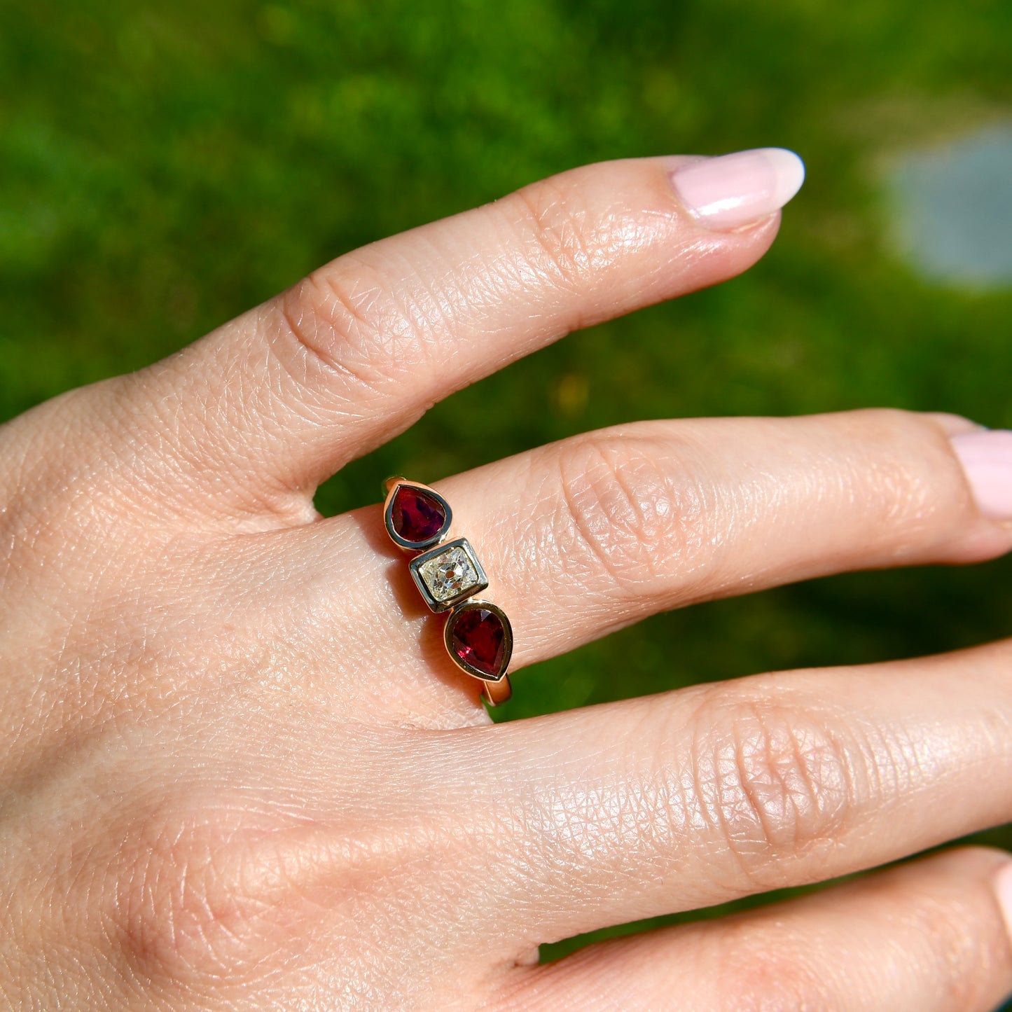 0.30 ct peruzzi cut diamond and pear ruby three stone ring