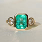 2.65 ct Colombian emerald and old mine cut diamond three stone ring