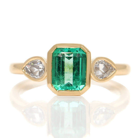 0.91 ct Colombian emerald and pear rose cut diamond three stone ring