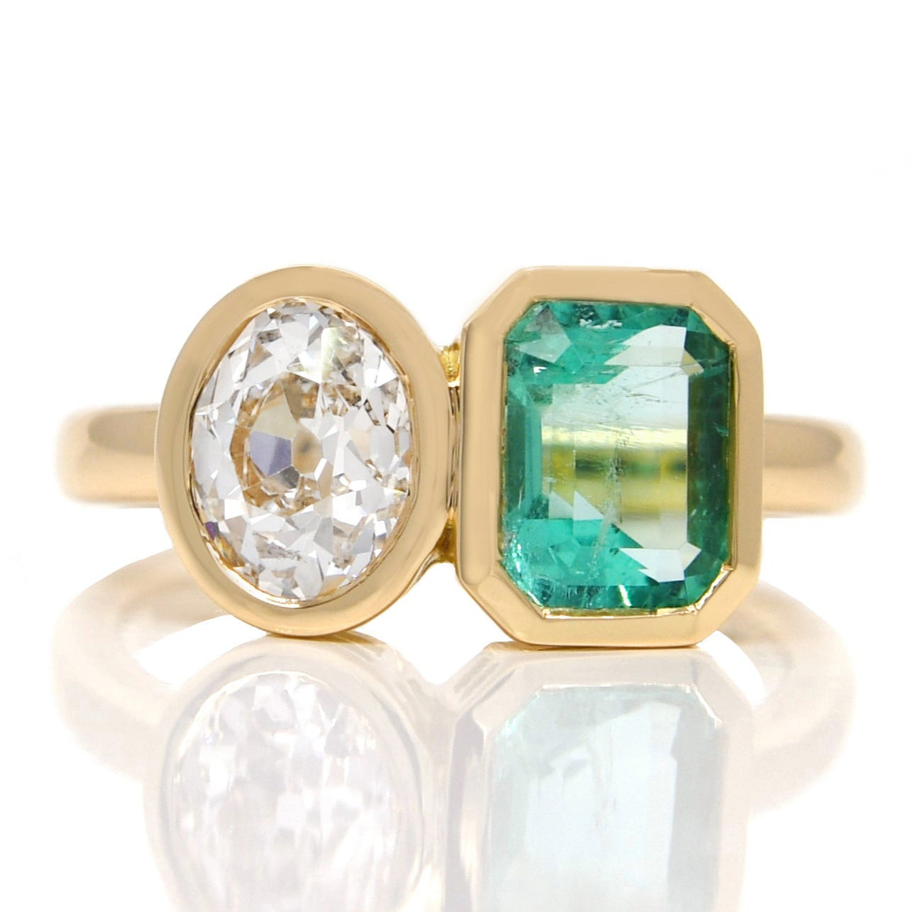 1.02 ct Colombian emerald and oval old mine cut diamond Toi et Moi ring