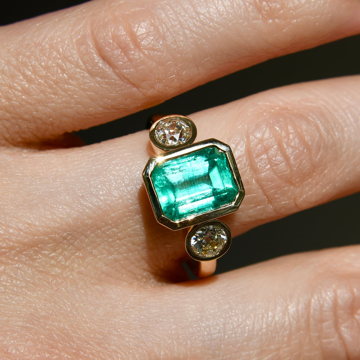 2.65 ct Colombian emerald and old mine cut diamond three stone ring