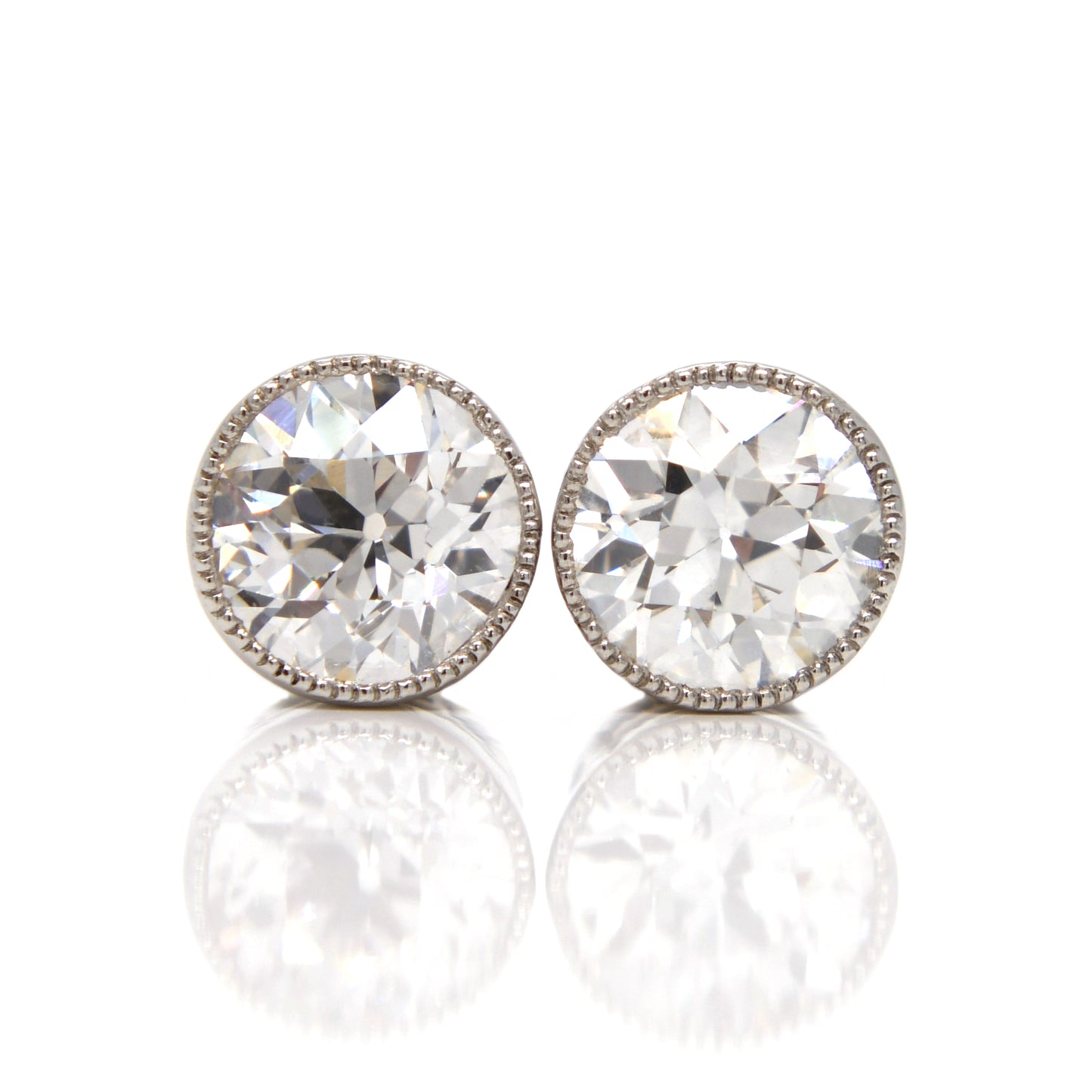 Installment 5/8 - 1.20 ct old European cut diamond studs