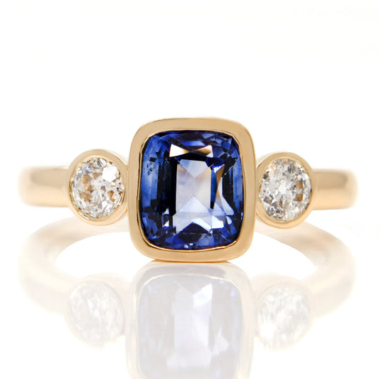 1.74 ct sapphire and old European cut diamond three stone ring