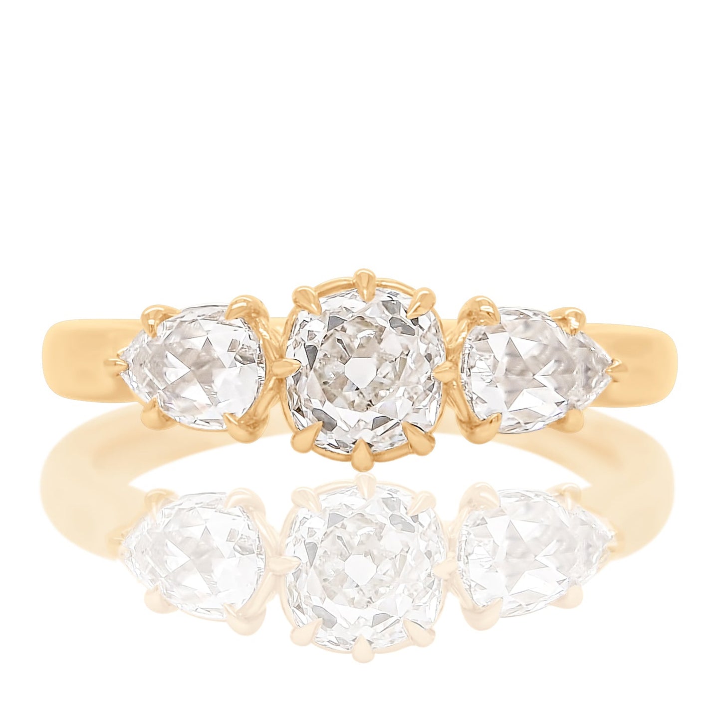 0.63 ct old mine and pear rose cut diamond three stone ring