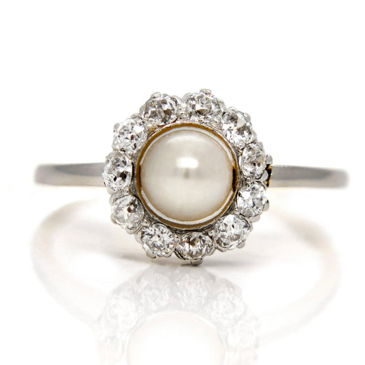 Antique 0.50ct old mine cut diamond and pearl halo ring