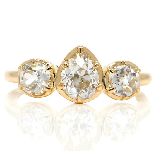 0.61 ct old pear and old mine cut diamond three stone ring