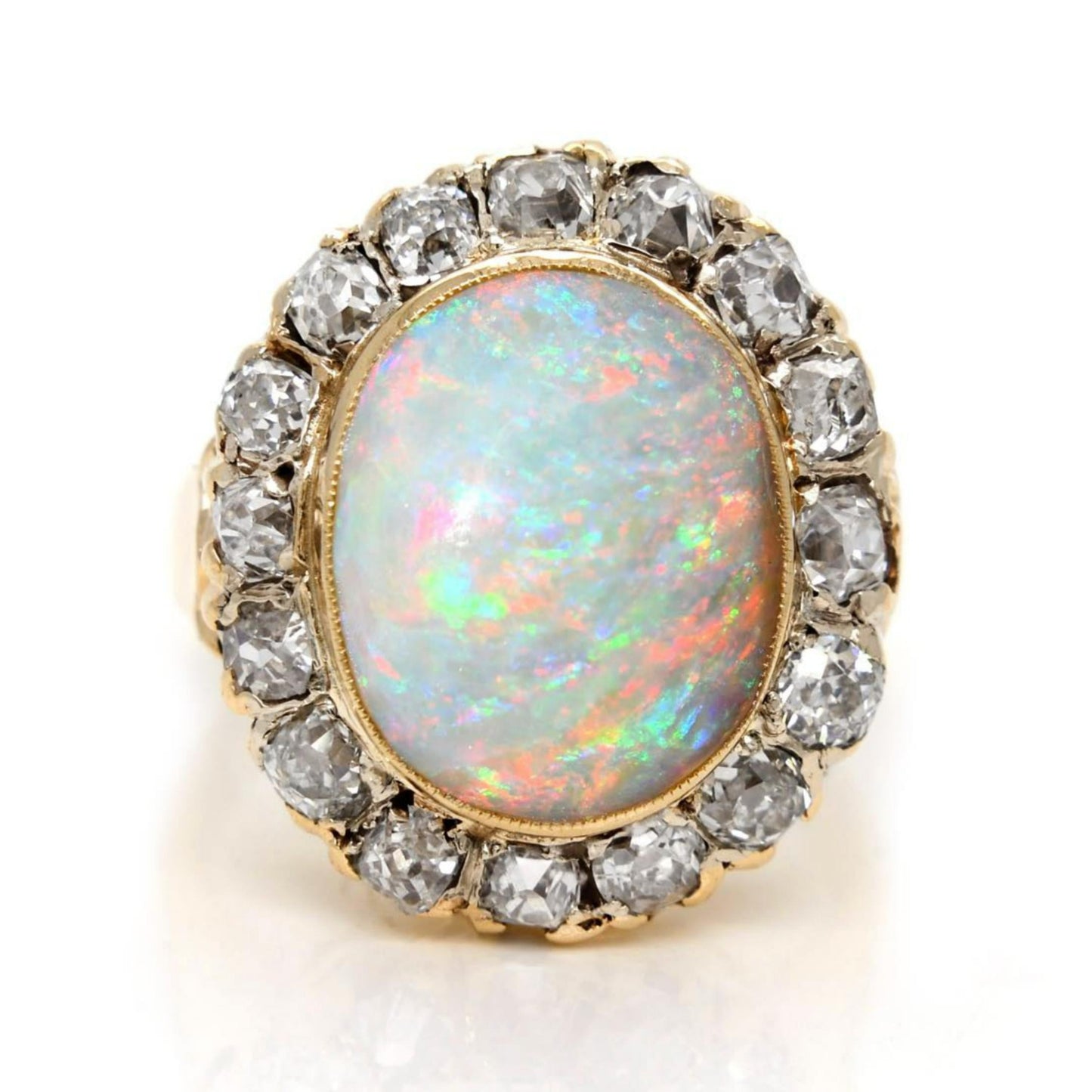 Antique opal and old mine cut diamond halo ring