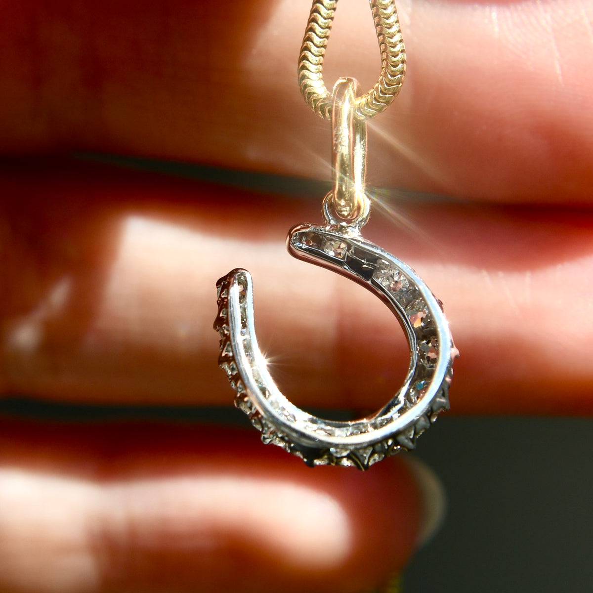 Antique 0.60 ct old European cut diamond horseshoe pendant