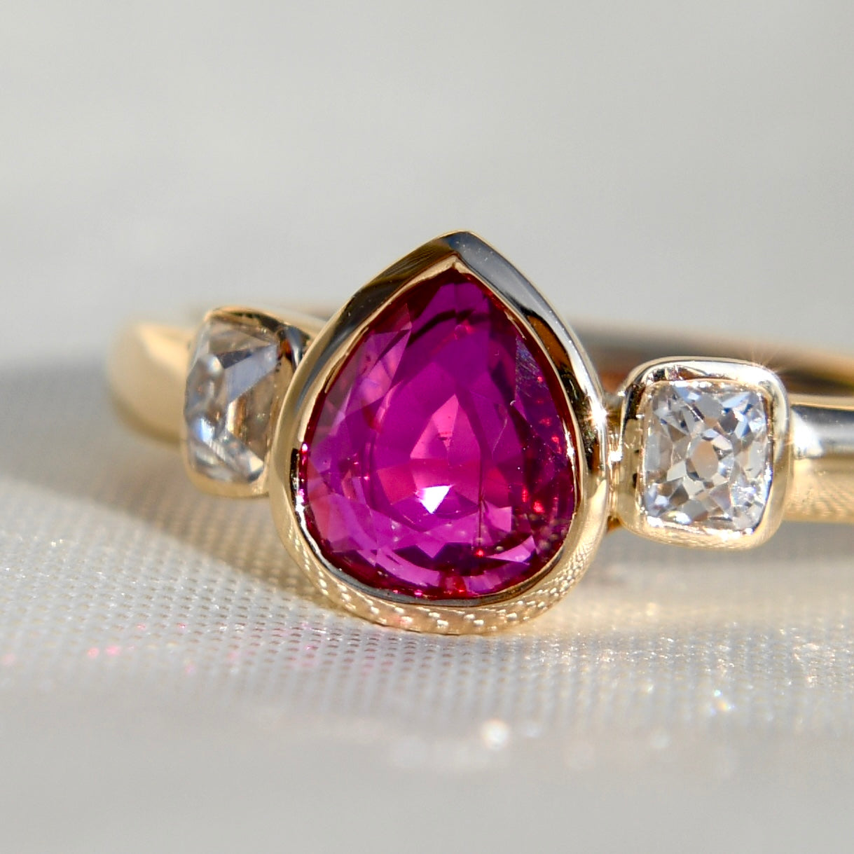1.01 ct ruby and peruzzi cut diamond three stone ring