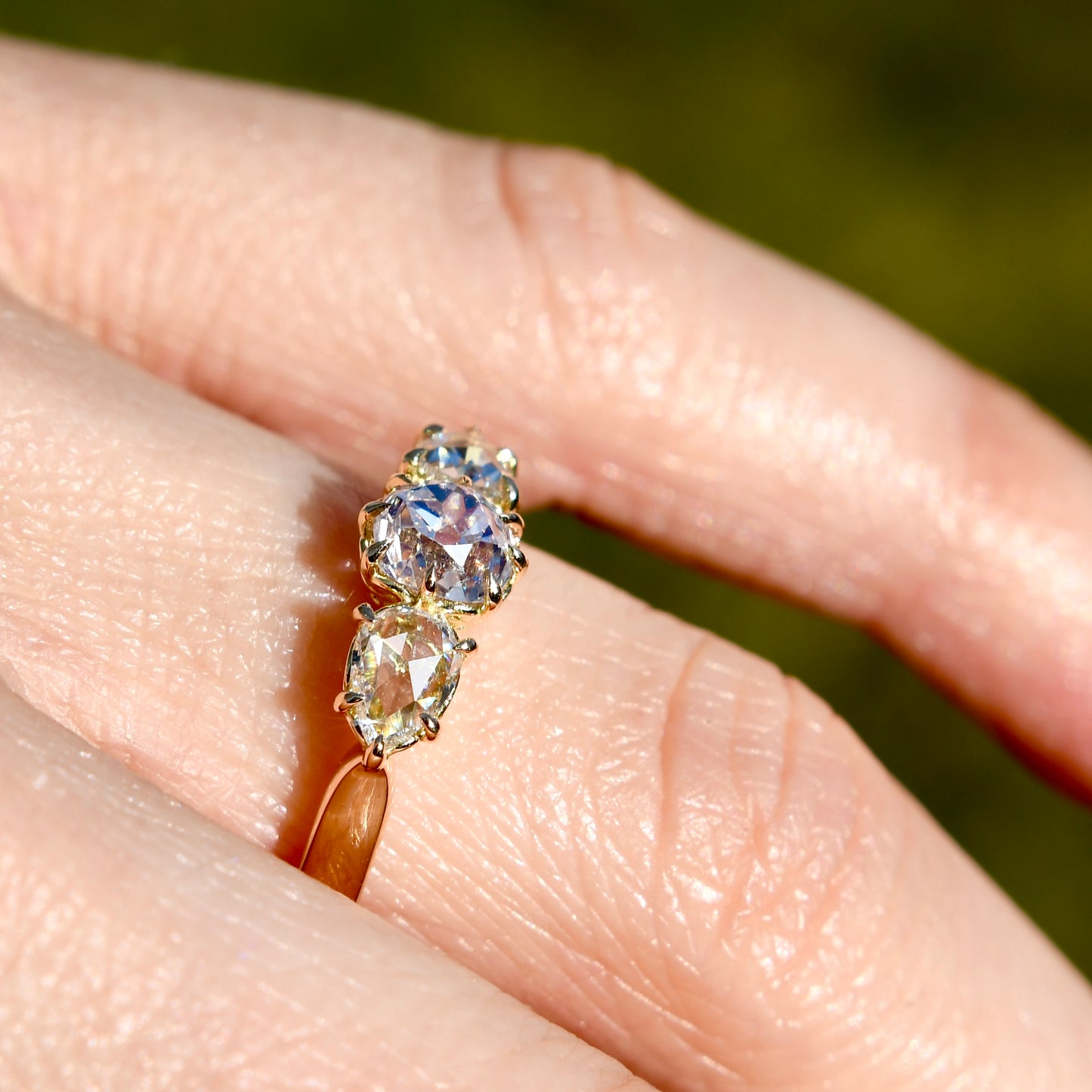 0.63 ct old mine and pear rose cut diamond three stone ring