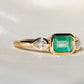 0.69 ct Colombian emerald and old pear cut diamond three stone ring