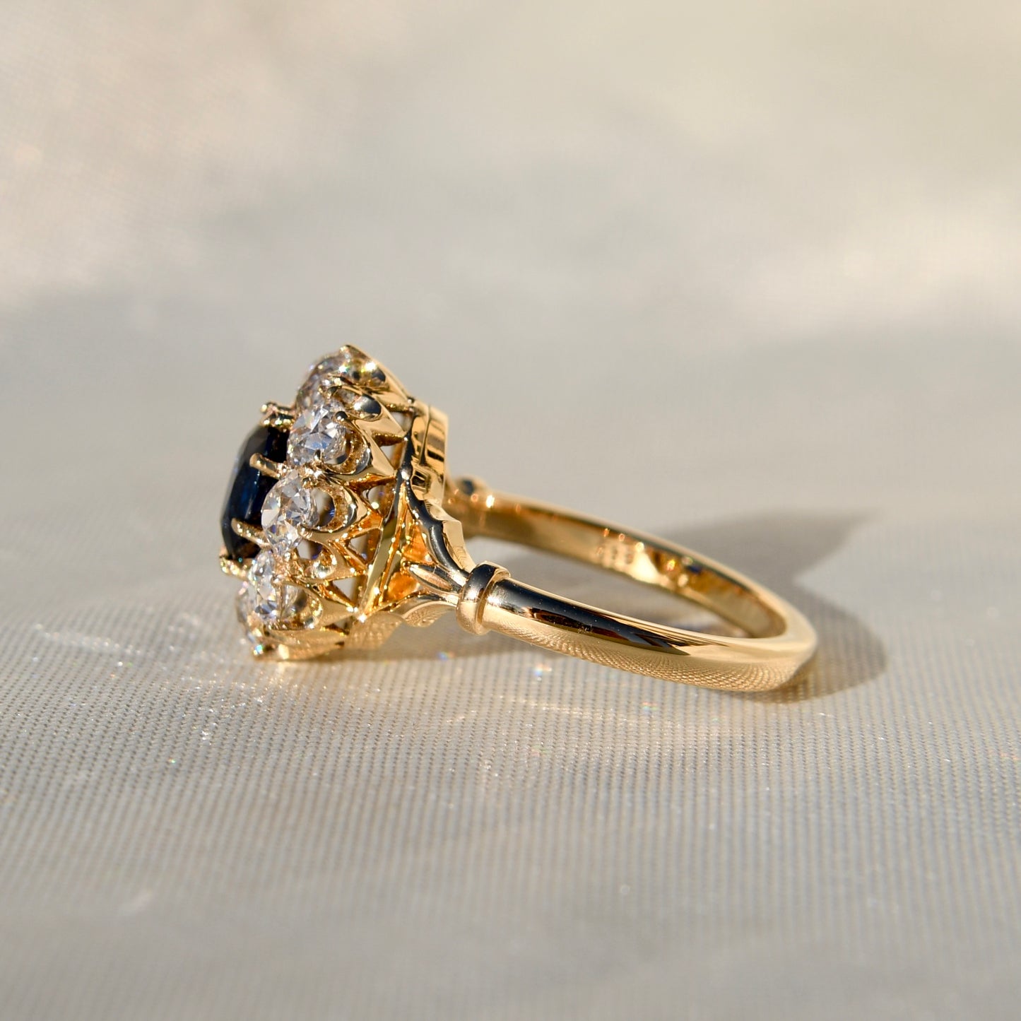 1.15 ct sapphire and old mine cut diamond cluster ring