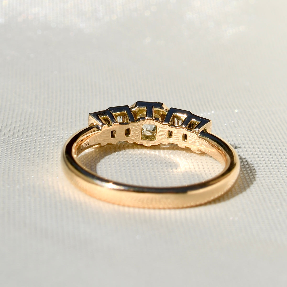 0.23 ct peruzzi and baguette cut diamond five stone ring