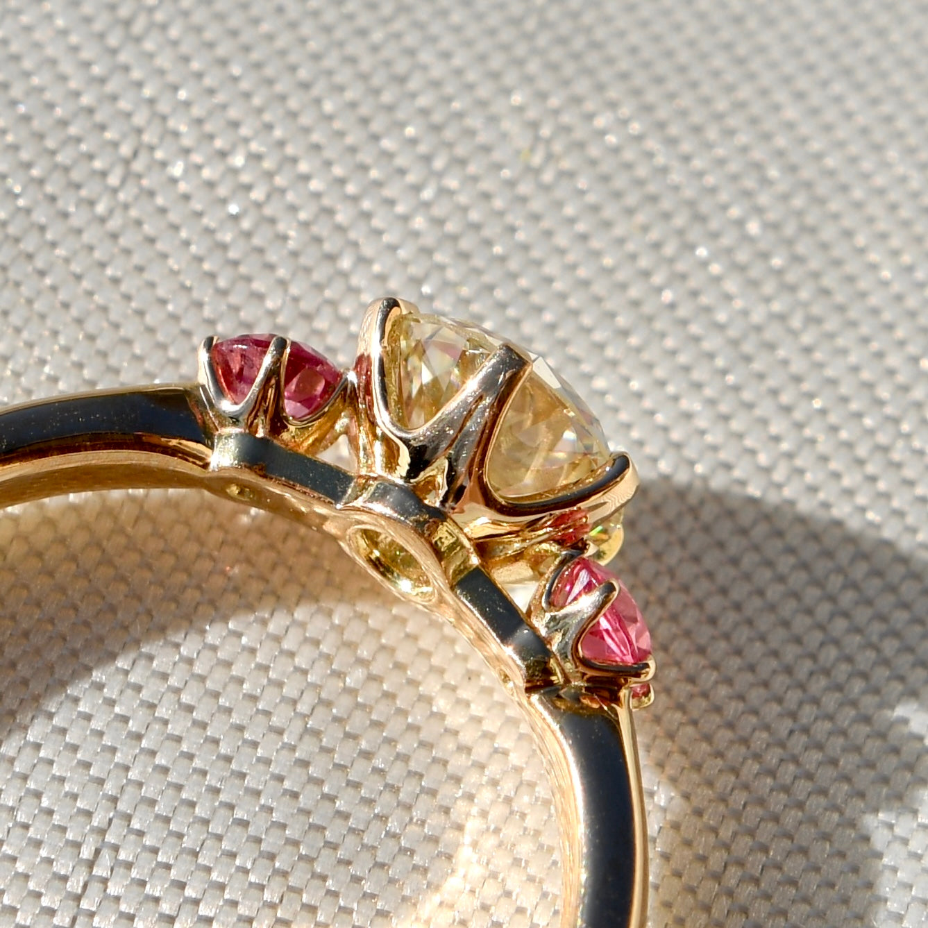 0.78 ct transitional cut diamond and spinel three stone ring