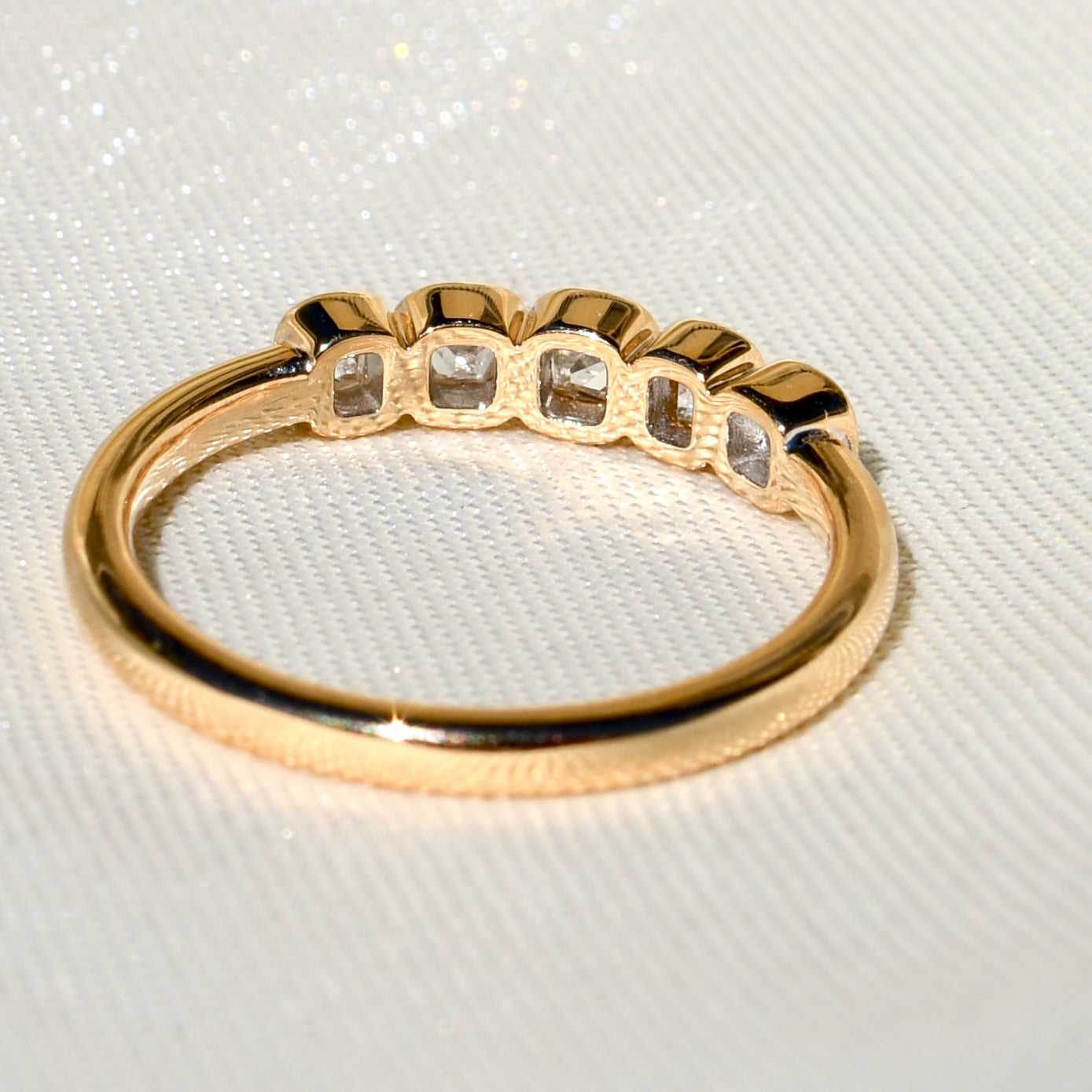 0.52 ct peruzzi cut diamond five stone band ring