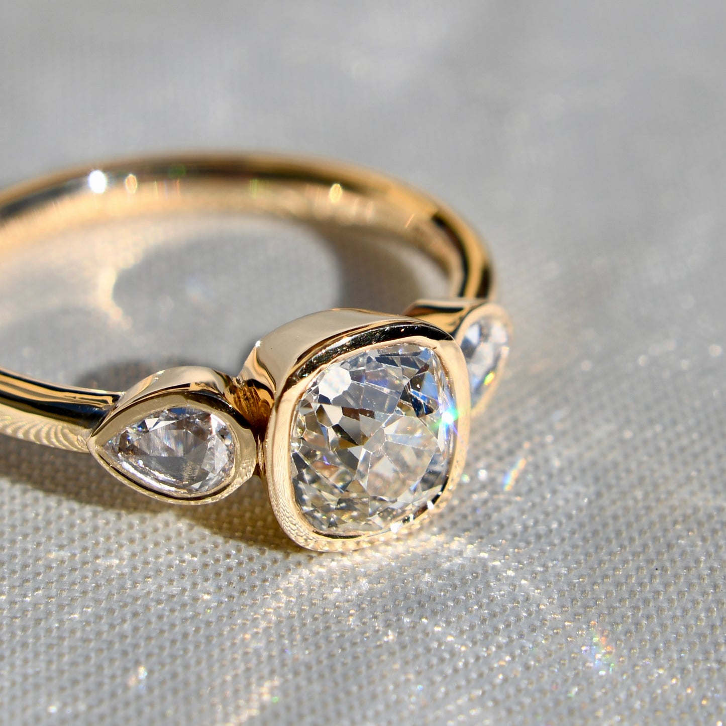 1.19 ct old mine and pear rose cut diamond three stone ring
