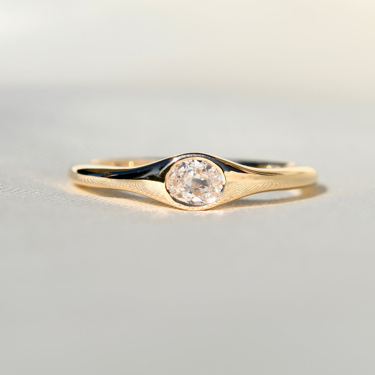 0.22 ct oval old mine cut diamond solitaire band ring