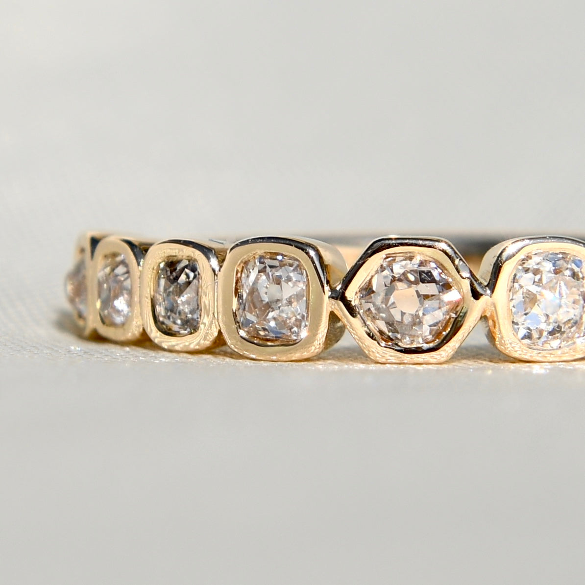 0.57 ct hexagonal, old mine and peruzzi cut diamond nine stone ring