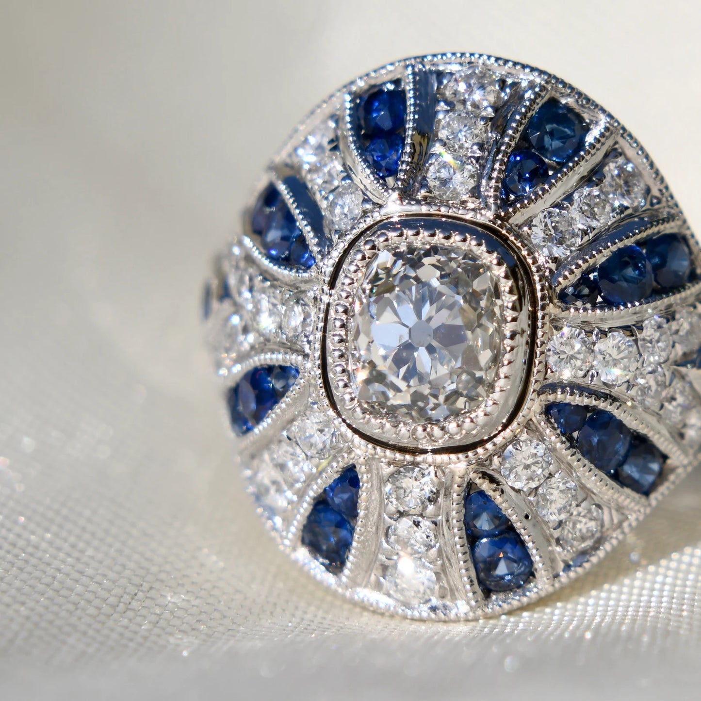 1.10ct old mine cut diamond and sapphire Bombé ring