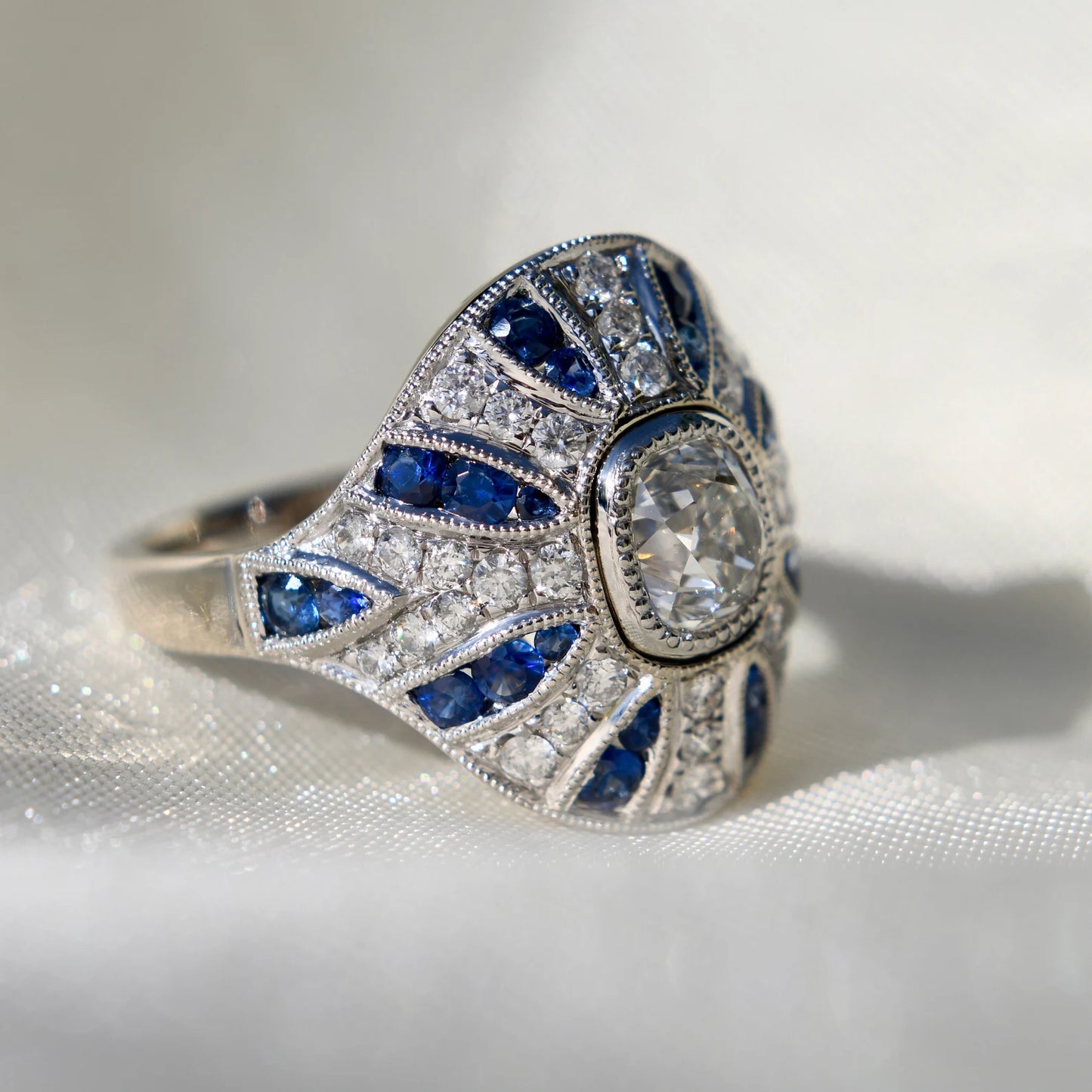 1.10ct old mine cut diamond and sapphire Bombé ring