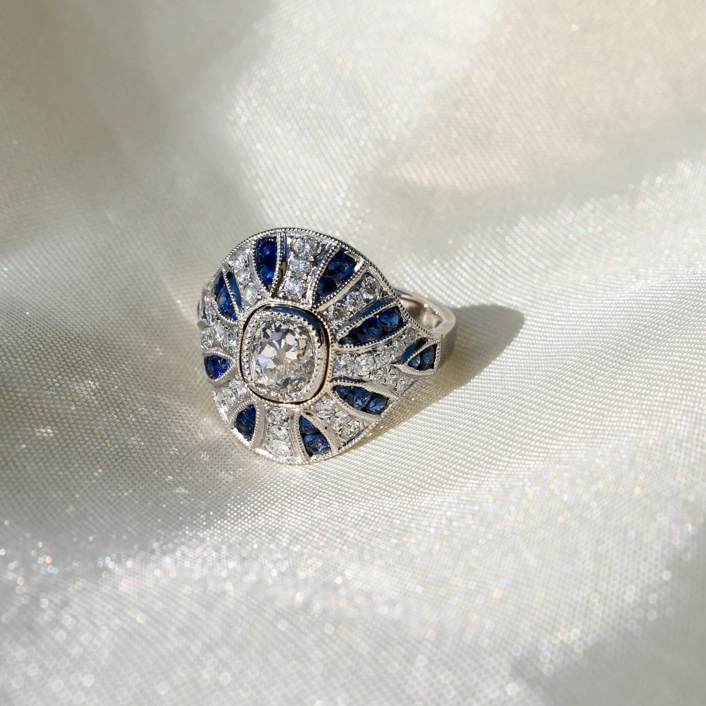 1.10ct old mine cut diamond and sapphire Bombé ring