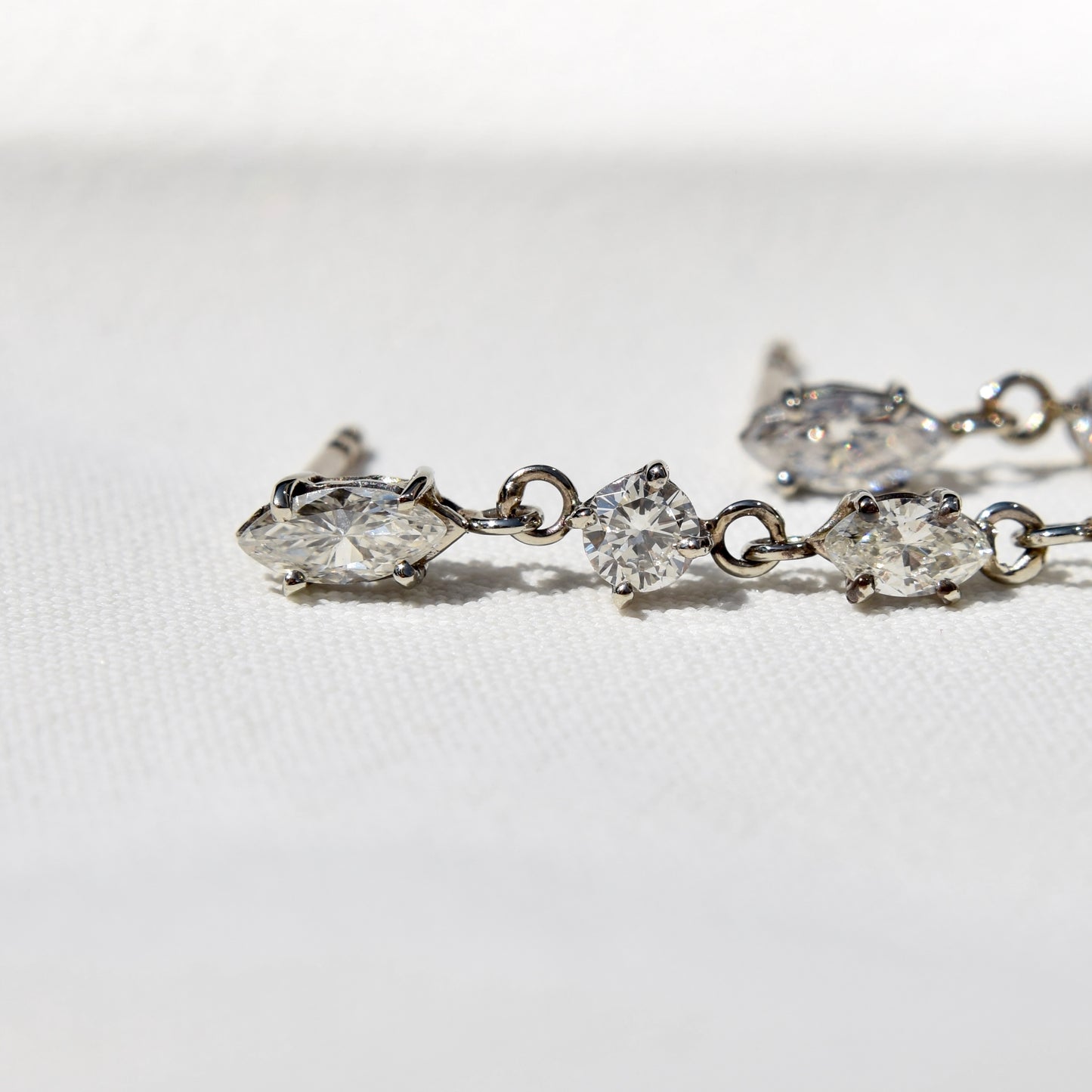 1.56ct mismatched diamond earrings