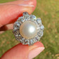 Antique Belle Époque natural pearl and 1.74 ct old European cut diamond daisy ring