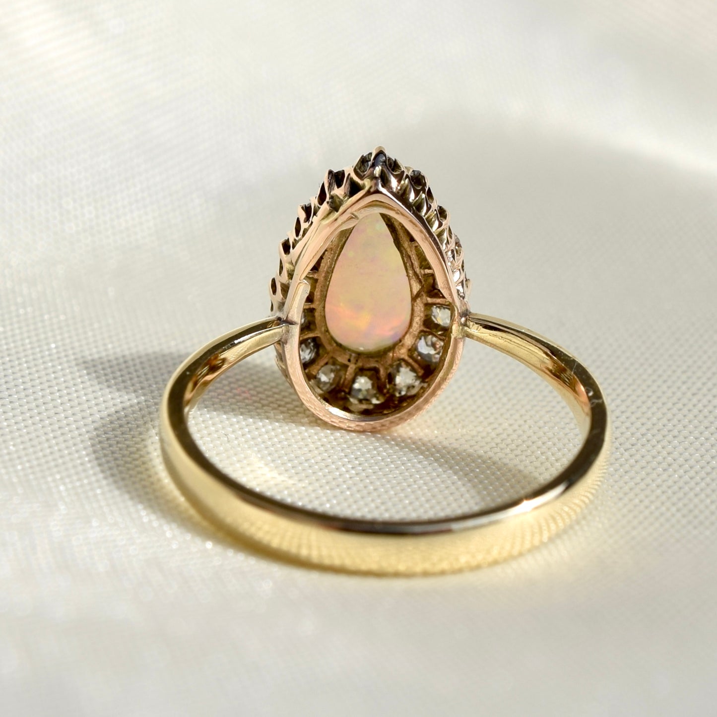 Opal pear and 0.32ct old mine cut diamond ring